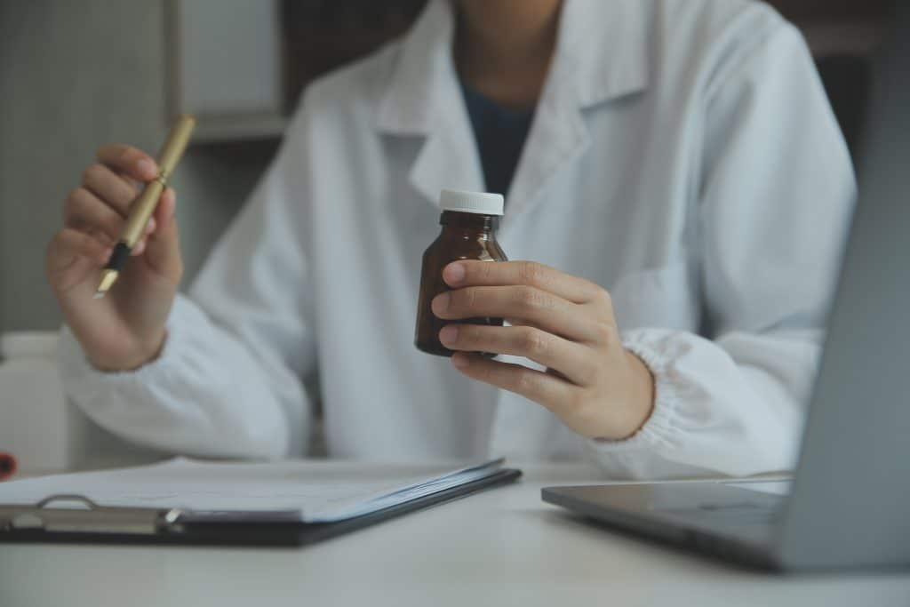 doctor holding medication