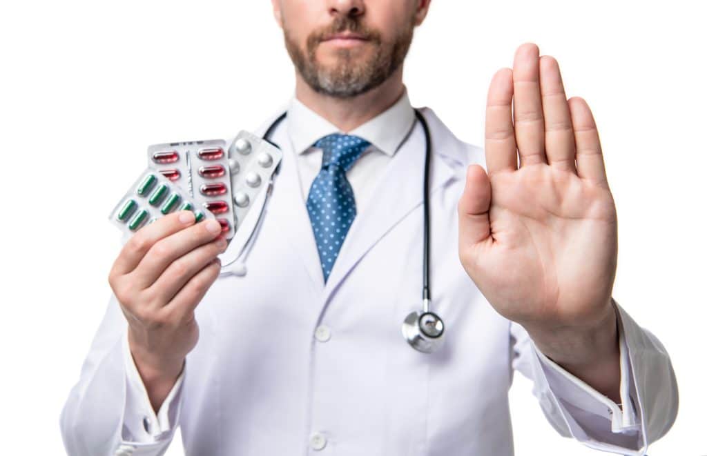 doctor holding compounded medications