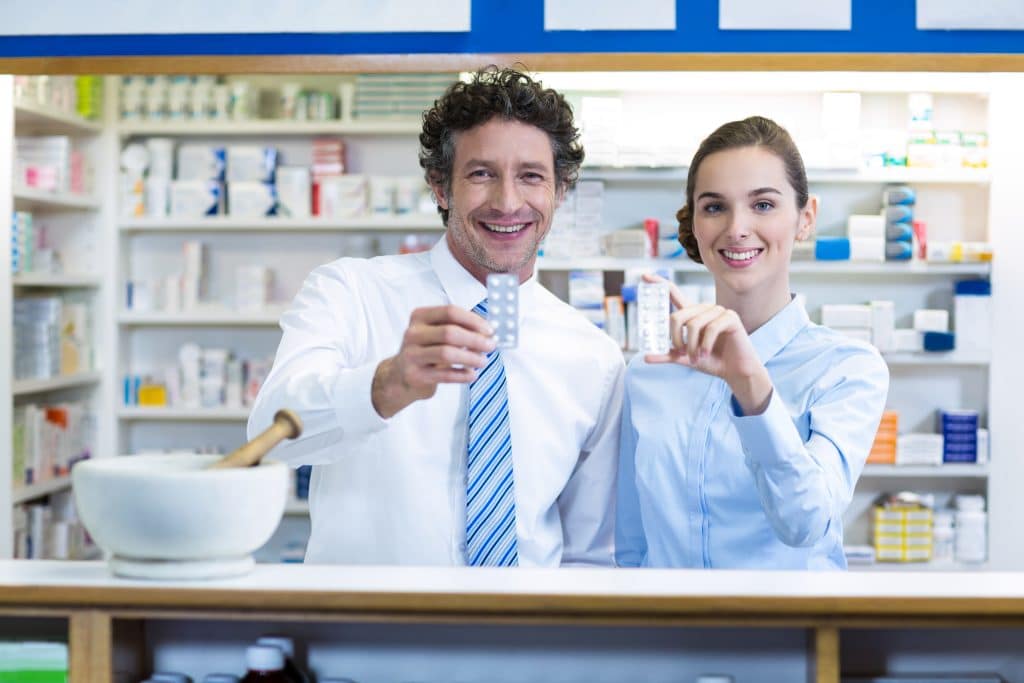pharmacists showing medication
