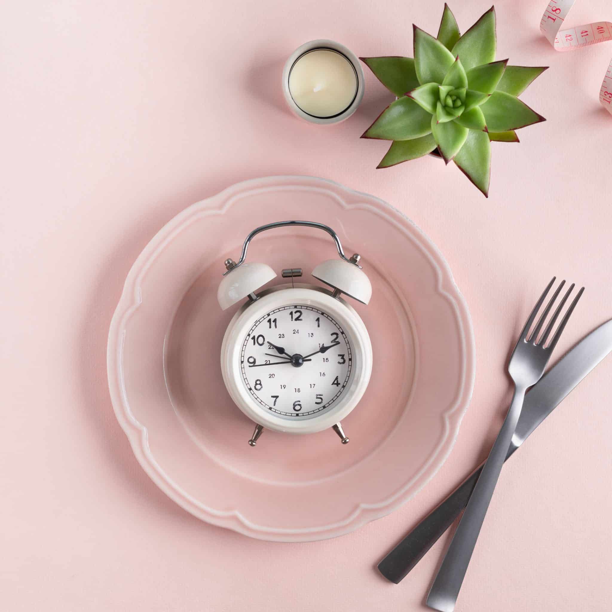 pink clock and plate