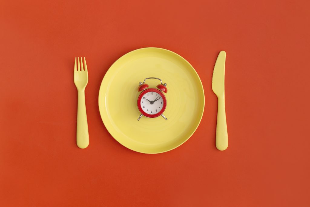 yellow plate with red clock